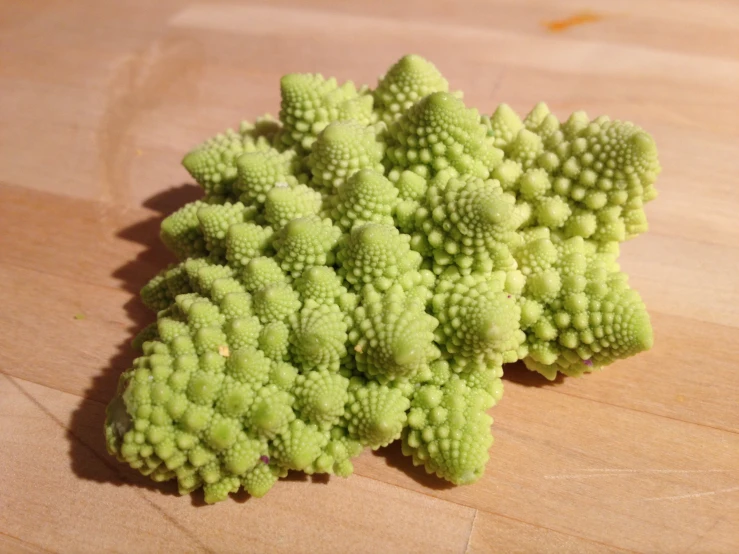 the green broccoli is on the table ready to be eaten