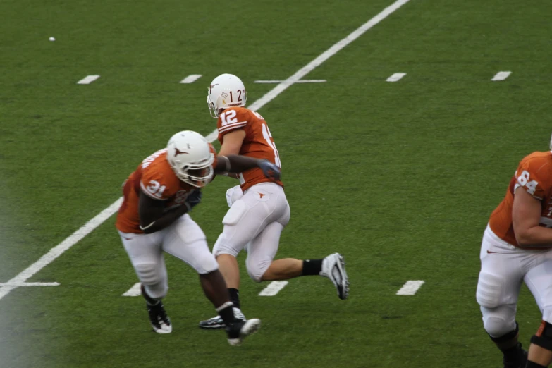 a football player is trying to get through another team