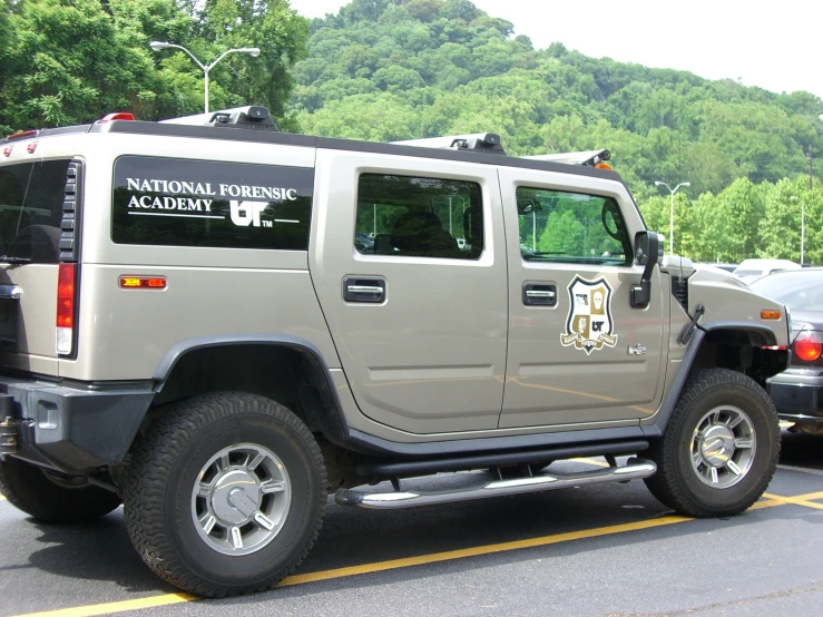 a large military hummer parked in a parking lot