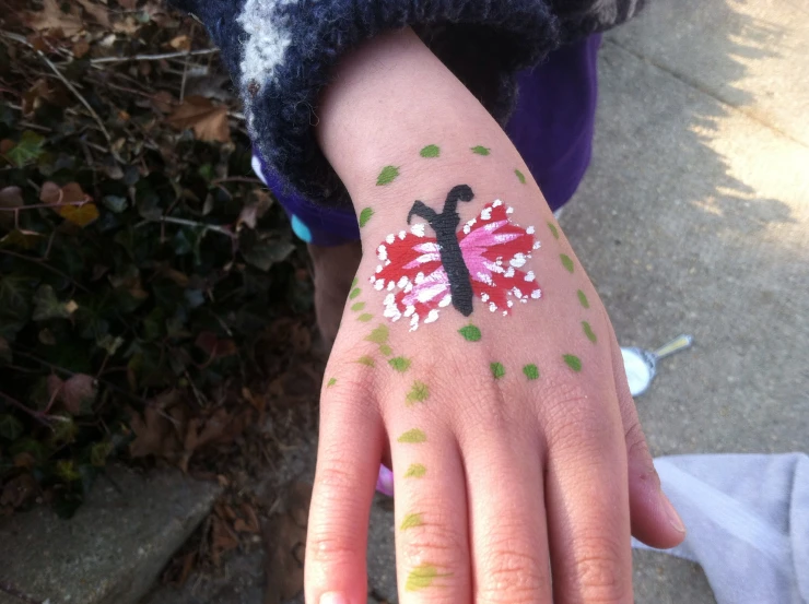 a  with her hand painted like a flower