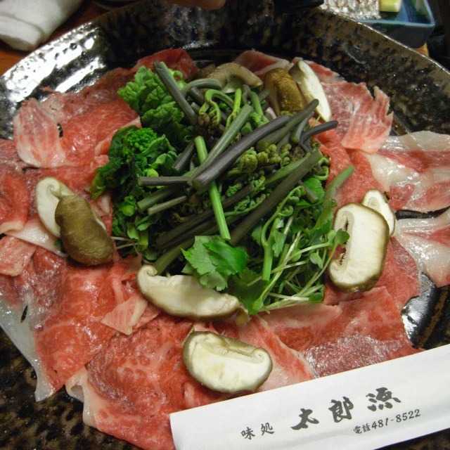 a platter with various types of veggies and meat