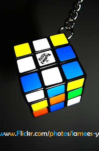 a necklace of colorful rubik cubes with black edges