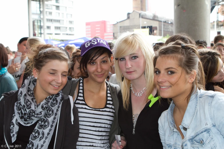 four ladies standing side by side at an event