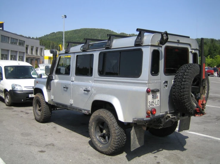 an off road vehicle is parked in the parking lot