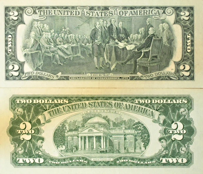 two us currency notes that are side by side