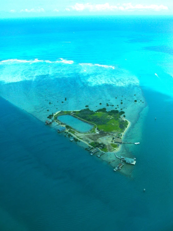 an island surrounded by water in the ocean