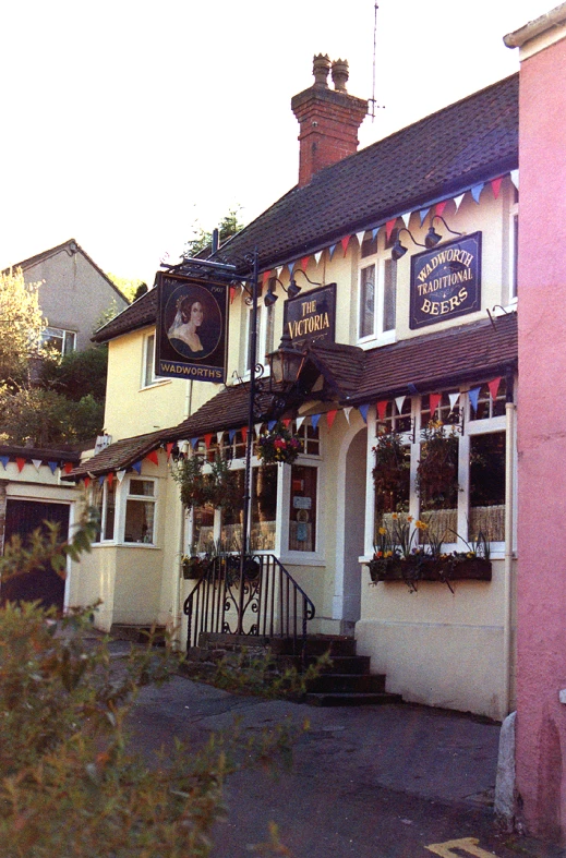 a building with flowers in its windows outside