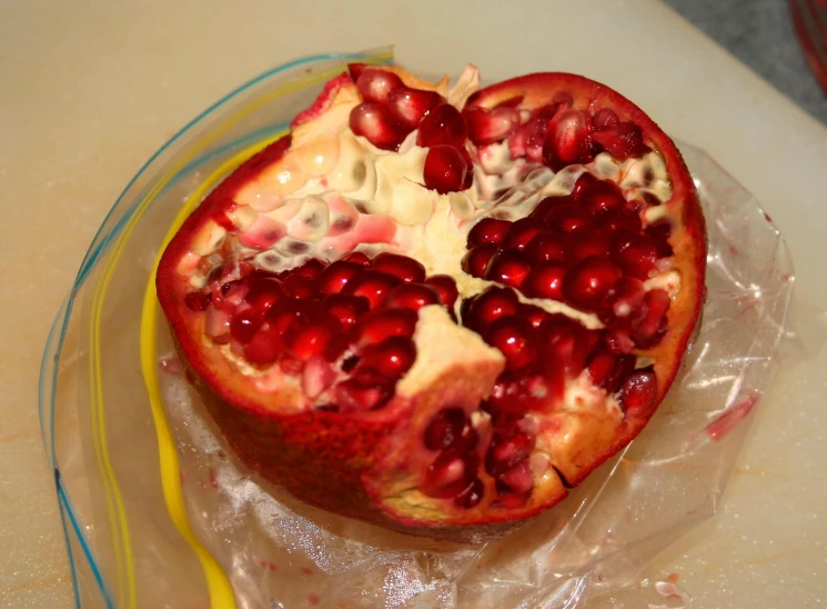 this pomegranate is the centerpiece to a piece of paper
