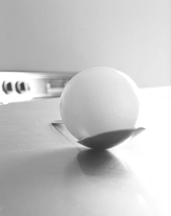a close up of a egg on a plate on a counter