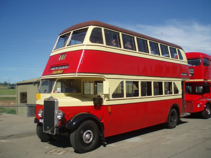 the two story bus is red and white