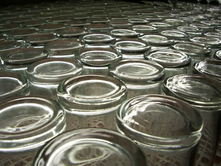 an image of many glass jar full of liquid