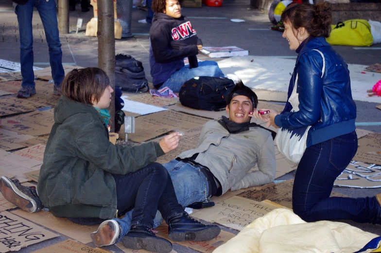 a person sitting on the floor laughing