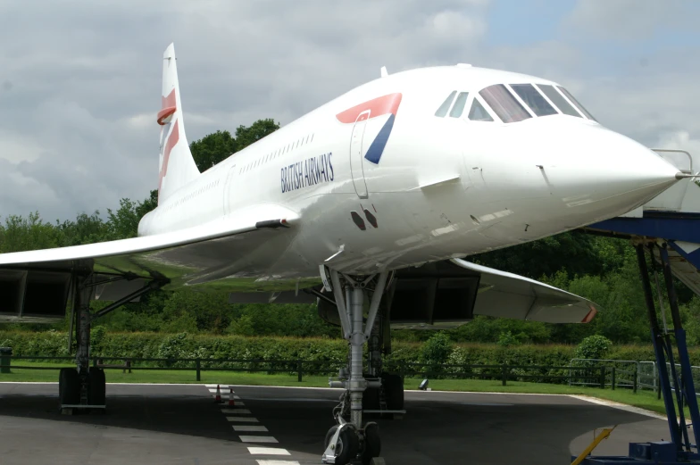 a small passenger jet sits on the tarmac