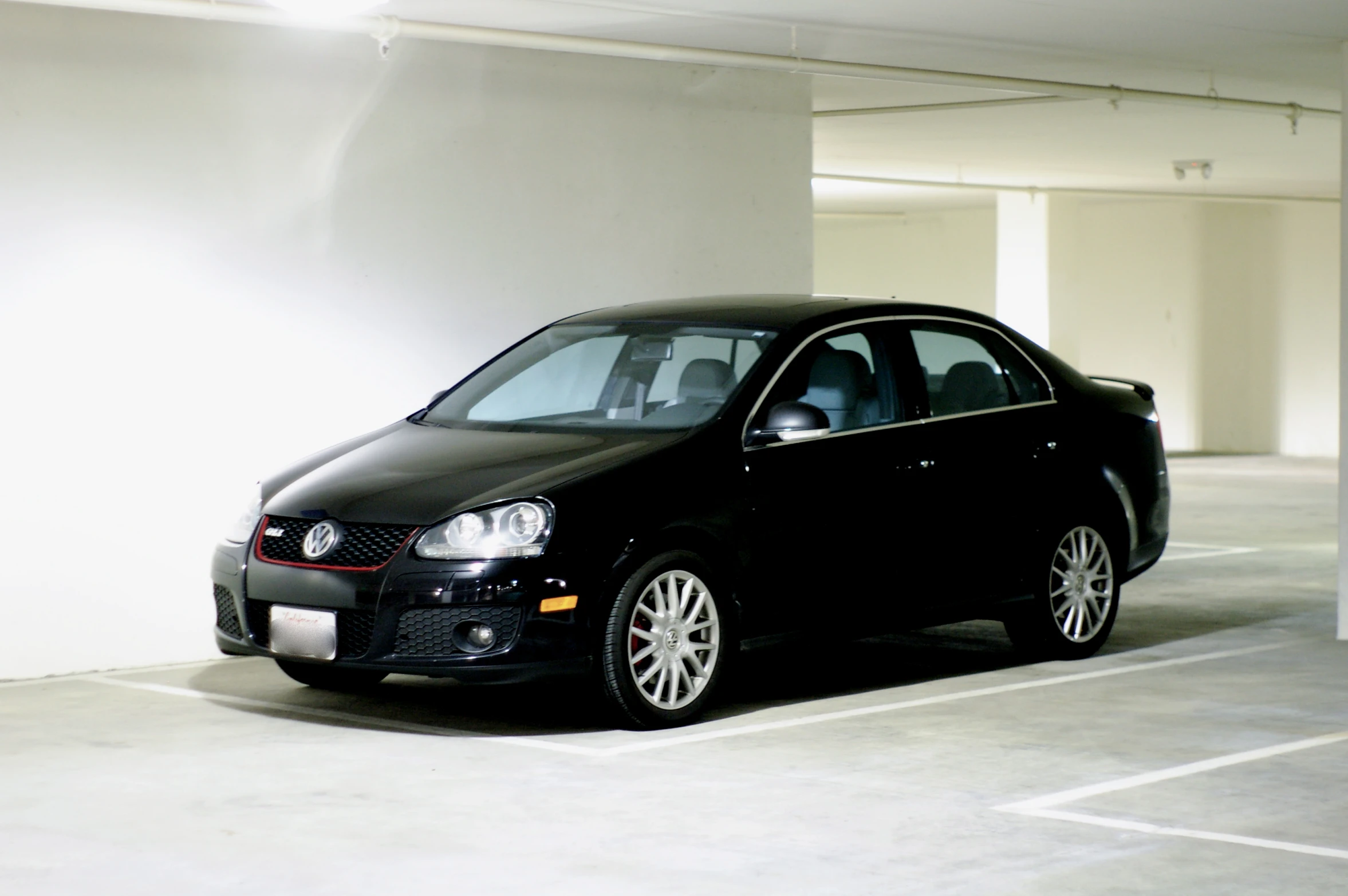 a car is parked in an underground parking lot