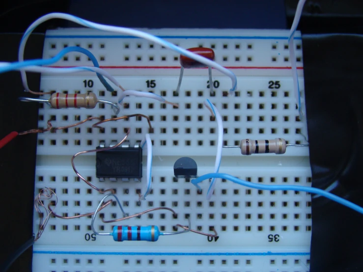 an electronic board with some wires and a mouse wire