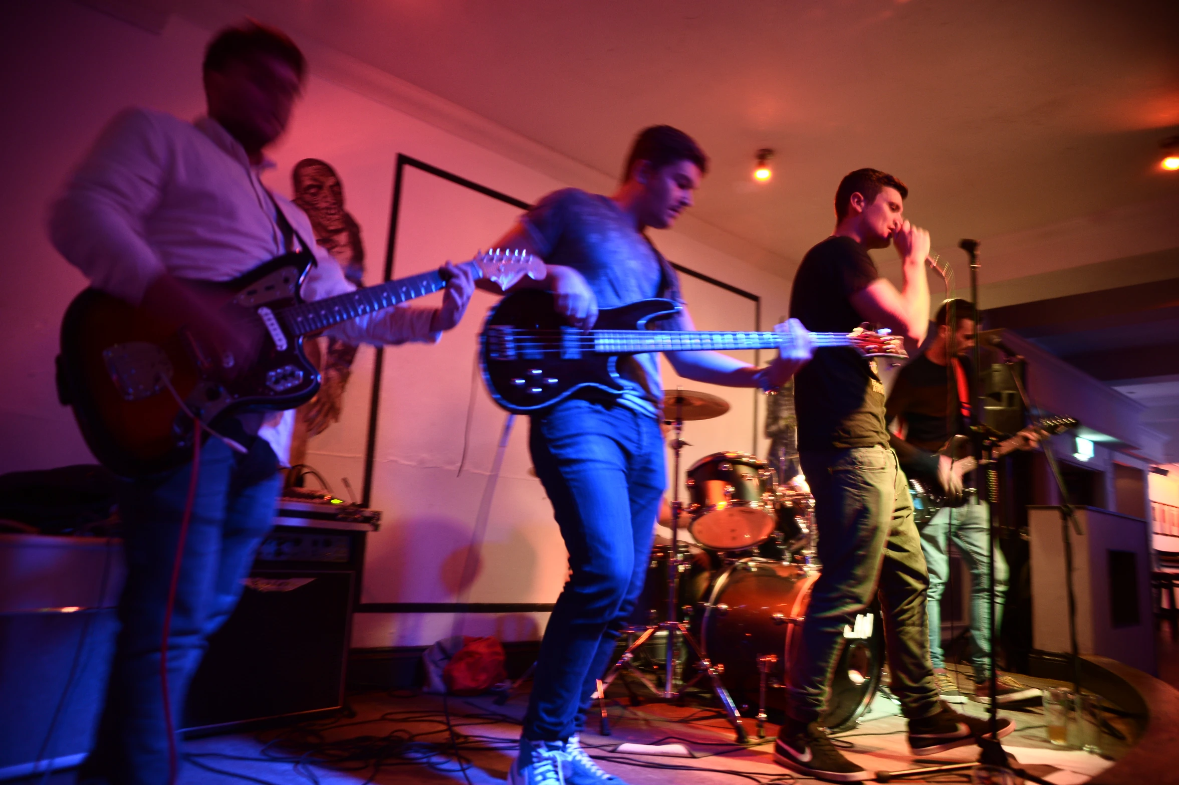 a group of people are performing with musical instruments