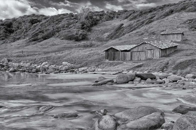 a black and white po of an old shed