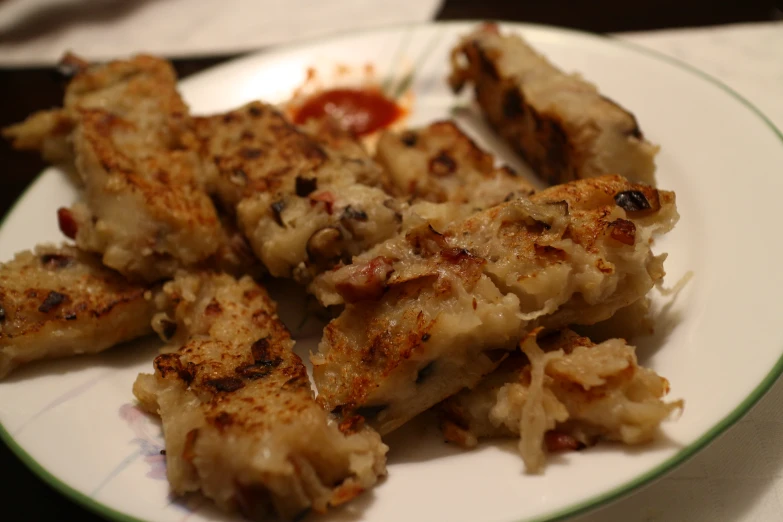 the plate holds several types of fried food