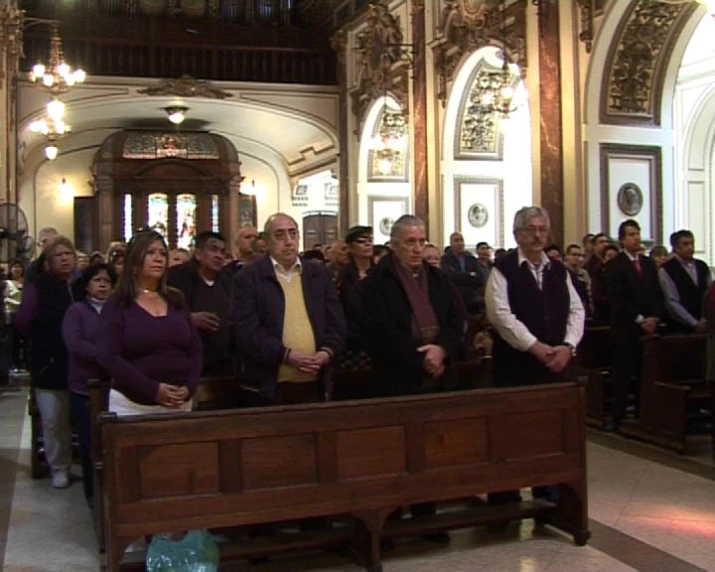 a group of people standing at a ceremony