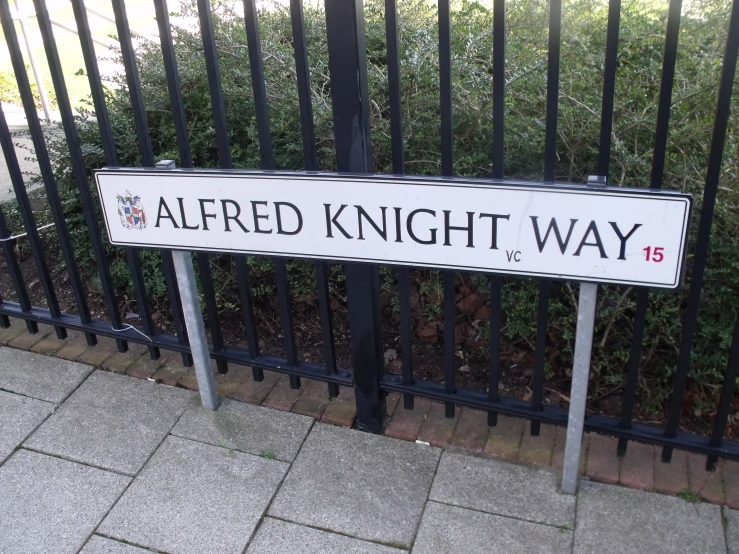 a sign that reads, altered knight way on the fence