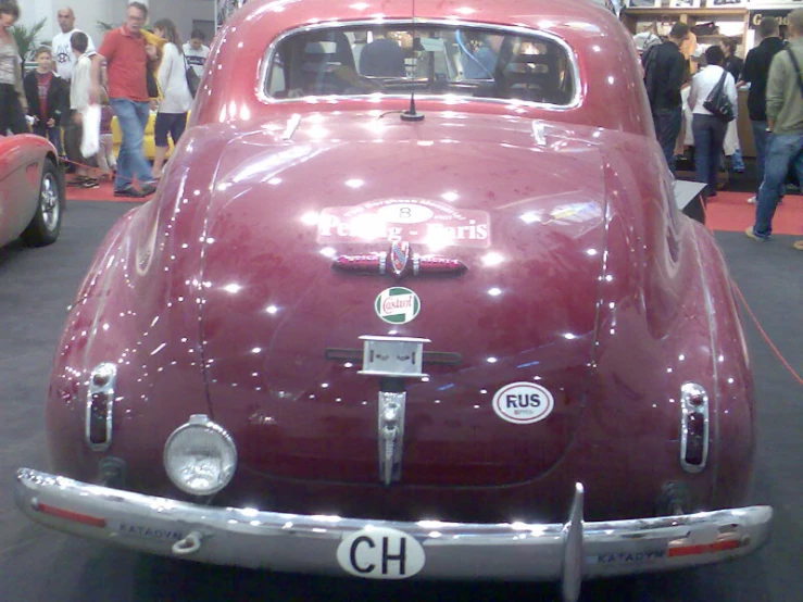 a vintage car on display at an auto show