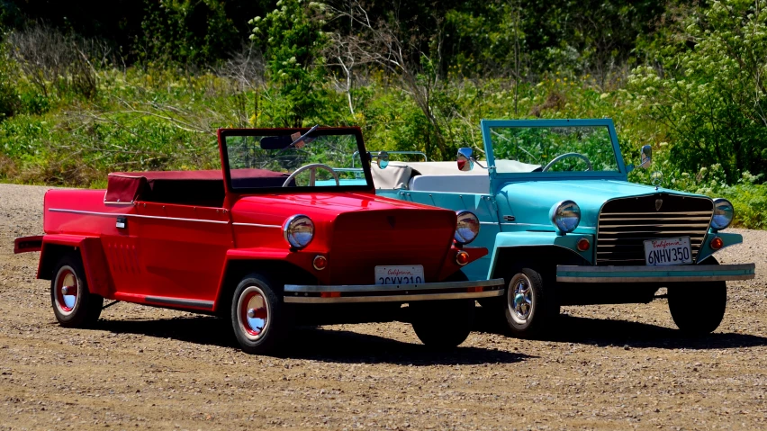 a blue truck and red truck are next to each other