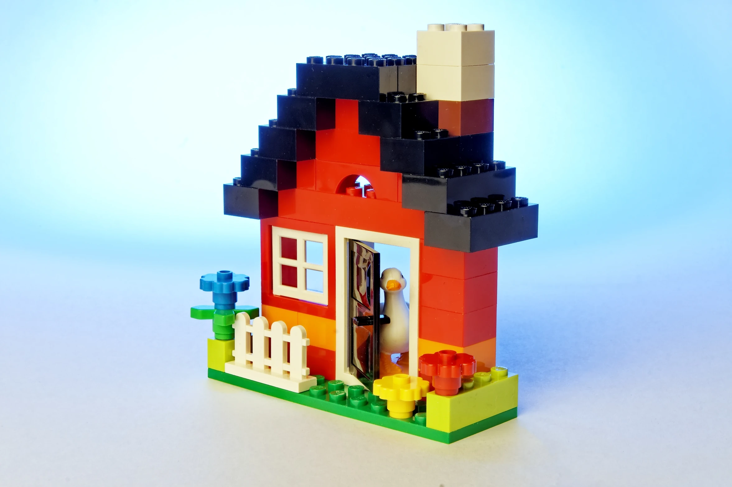 a colorful lego house with a black roof