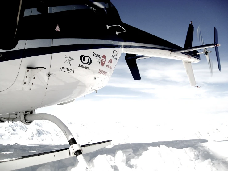 a po of a propellor plane with the cockpits extended