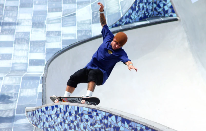 a man that is standing on a skateboard