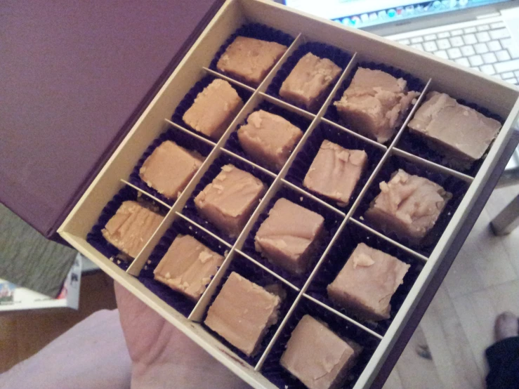 a box full of chocolates that are opened
