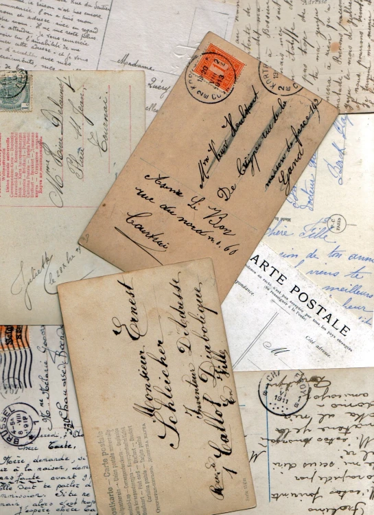 some old letters and postal papers with an envelope