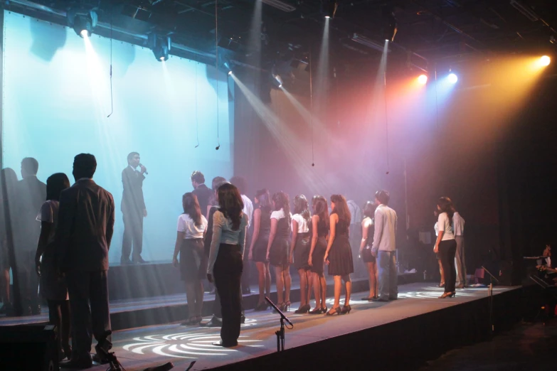 a group of people standing on a stage at a show