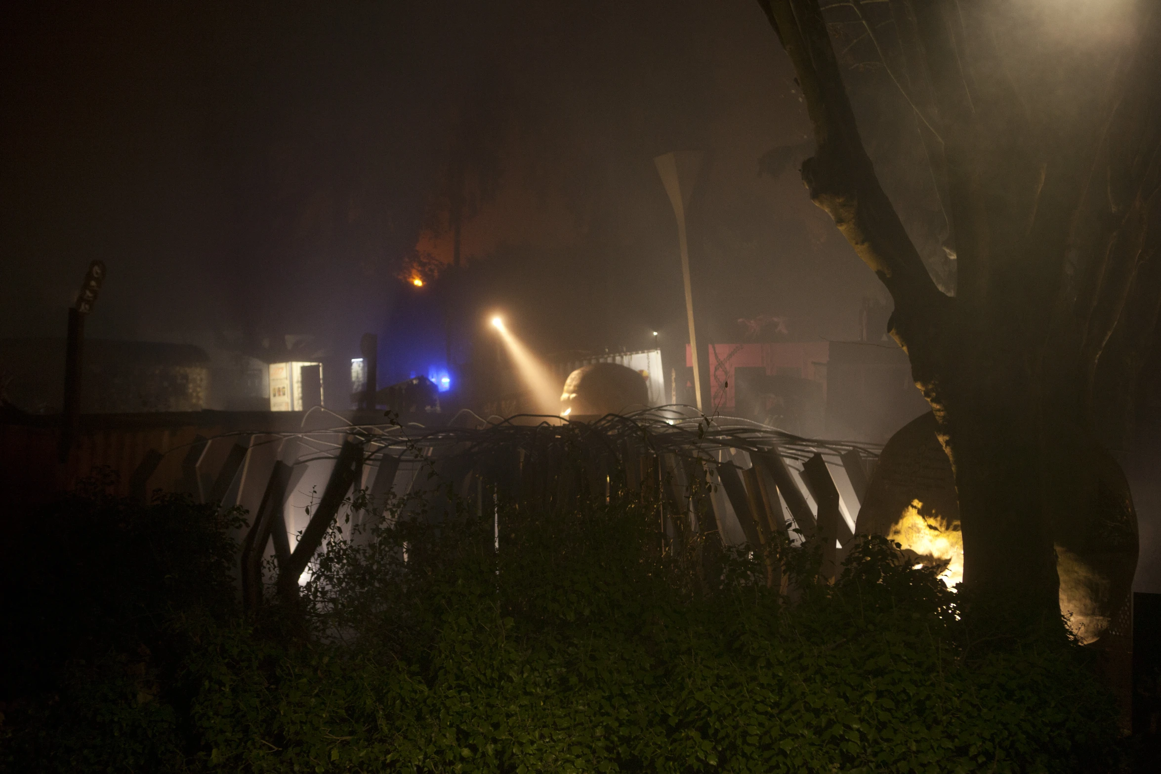 two people in front of firetruck at night