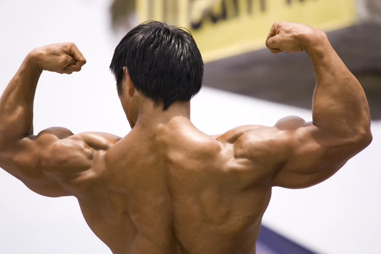 a man posing with his muscles showing