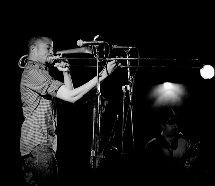 a man playing the trombone at a concert