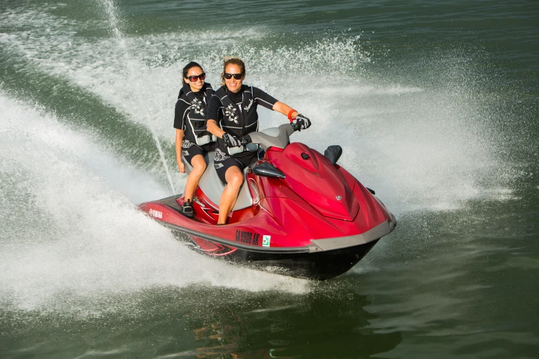 two people on a jet ski in the water