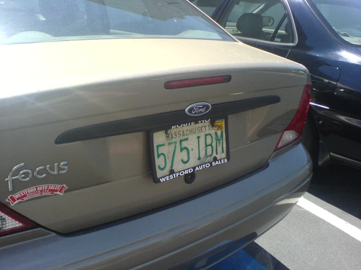 a license plate on the back of a ford car