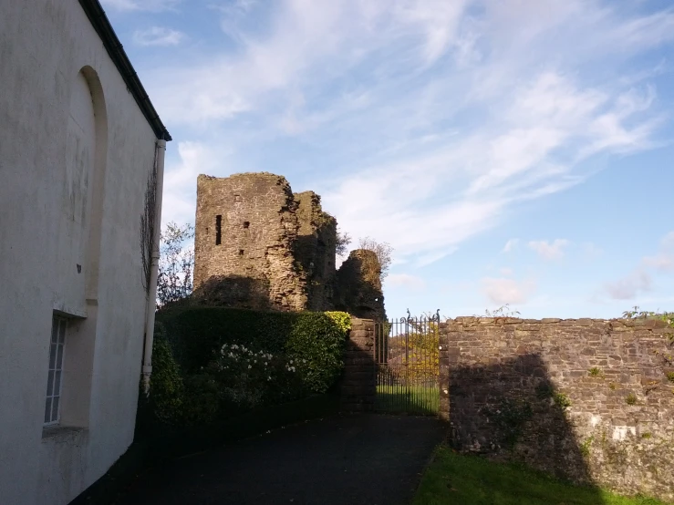 a stone building sitting on the side of a street