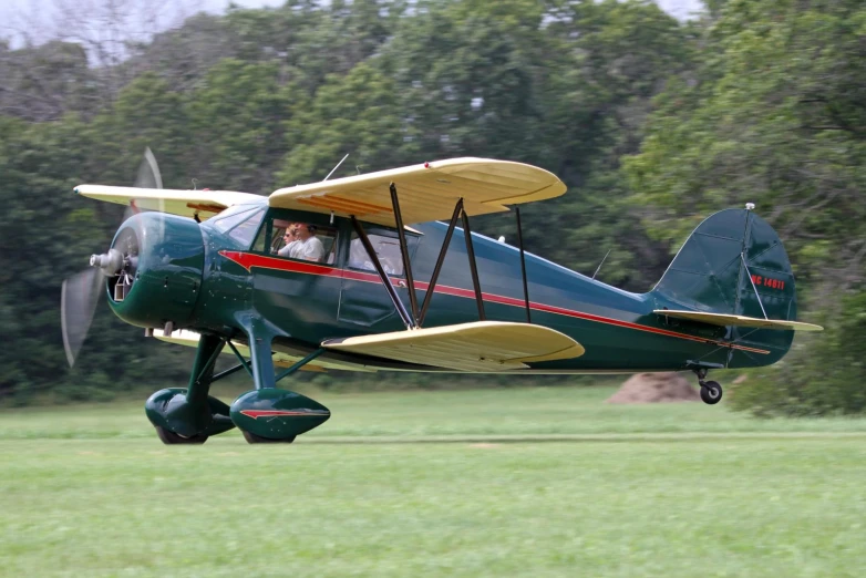 a small plane sitting in the middle of a field