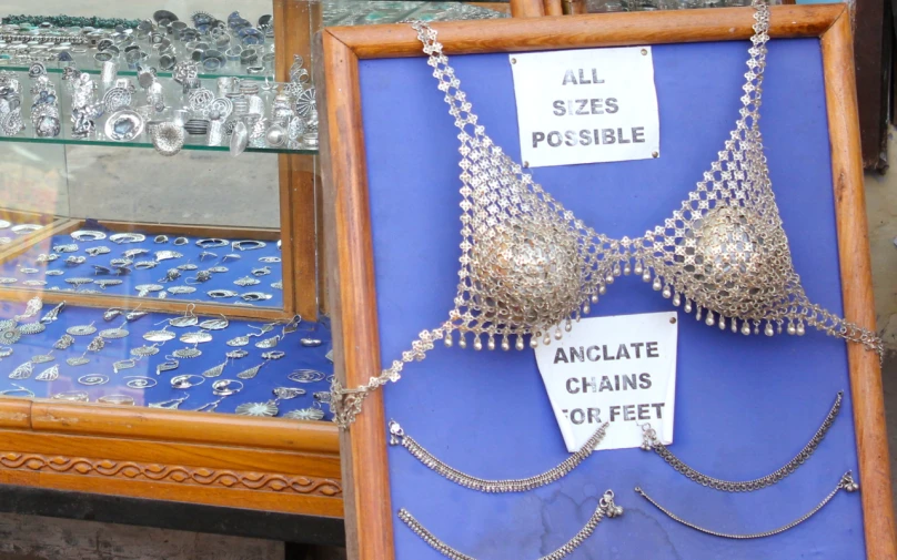 the display case is displaying s, chains and other jewelry