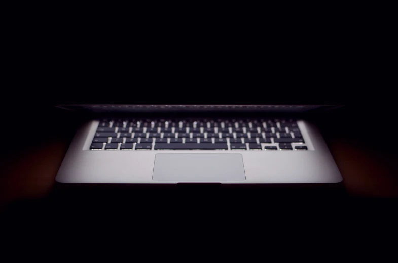 a macbook pro with some type of keyboard on it