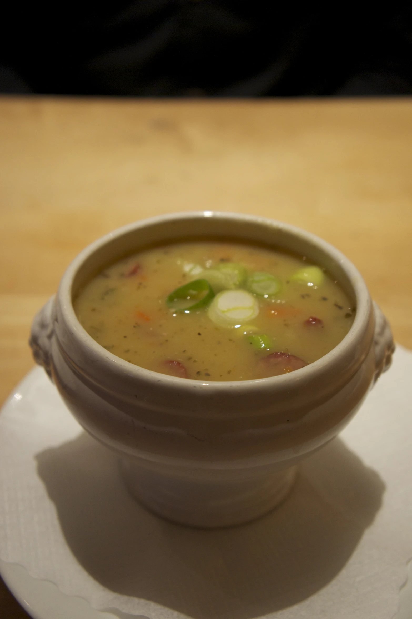 this is a bowl of soup on a plate