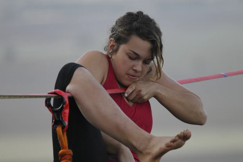 a female athlete holding her arm out in front of her