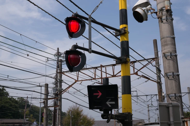 there are many street lights on the corner