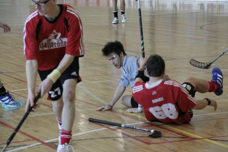 a couple of men playing a game of hockey