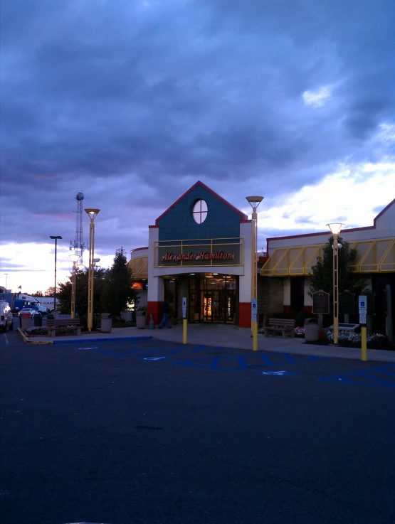 the front of a building with a large clock on it