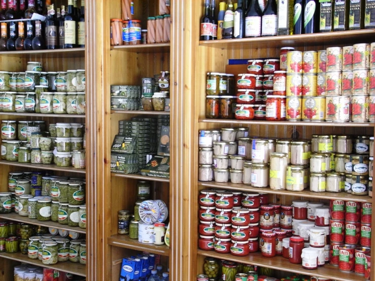 shelves full of jars and tins filled with different kinds of things