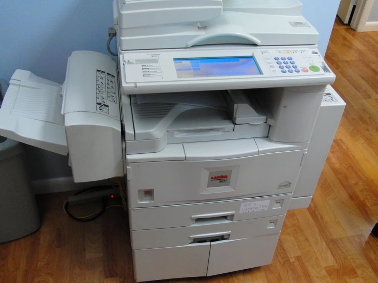 a machine sits next to two stacks of papers