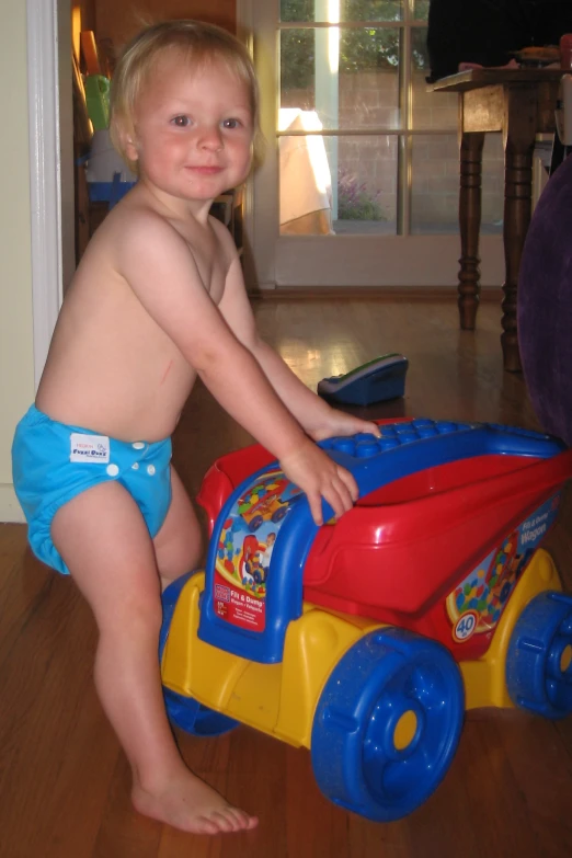 a little boy with  playing with a toy