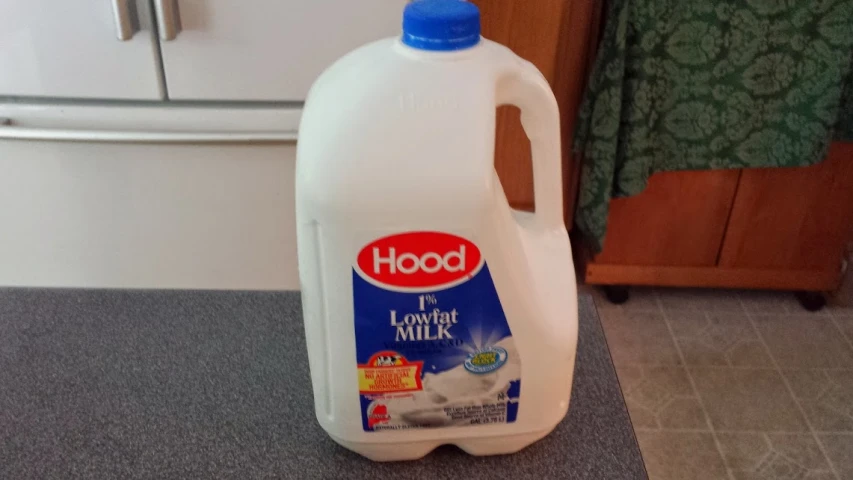 a gallon jug of liquid sitting on a counter